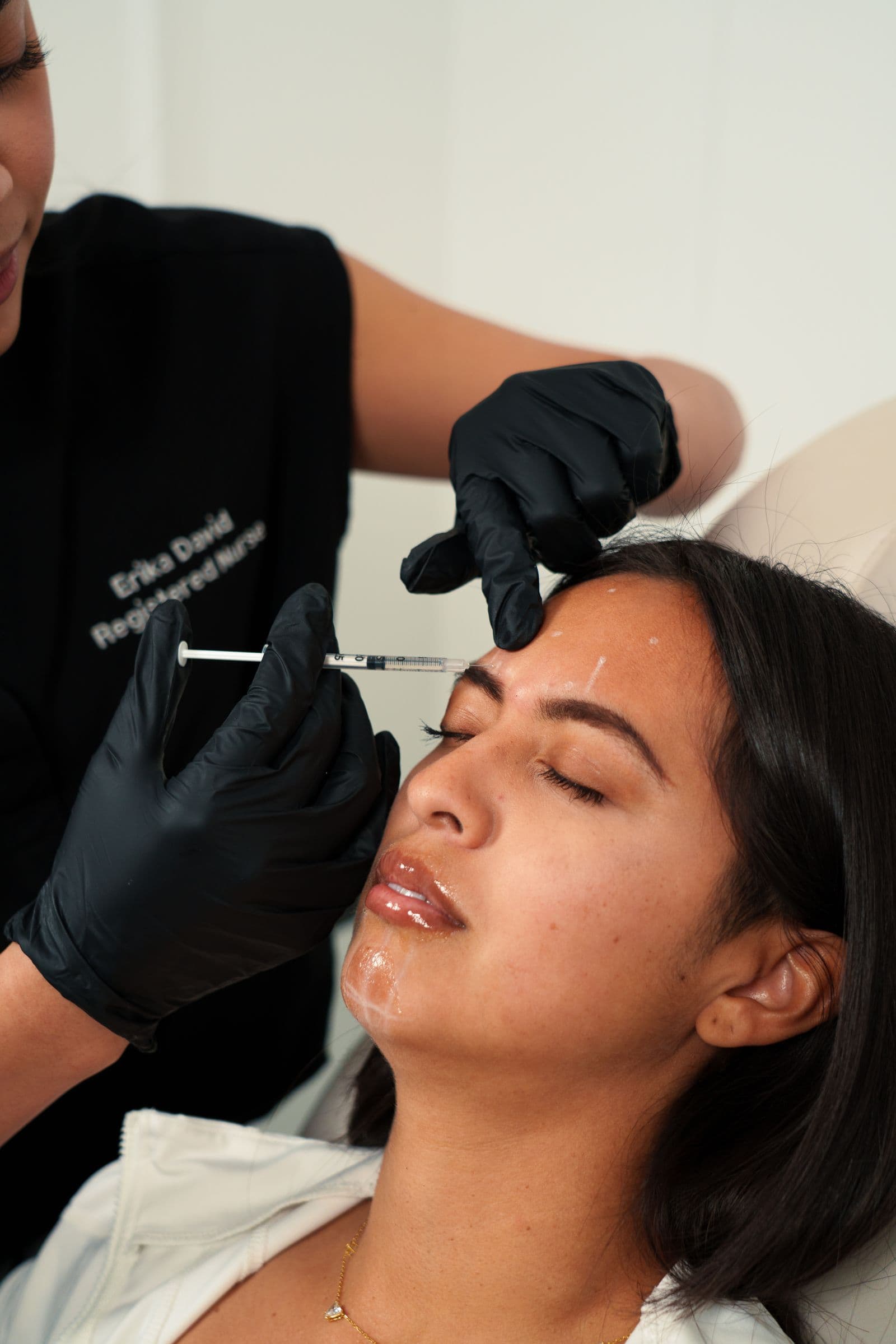Licensed practitioner administering an injectable treatment at a med spa